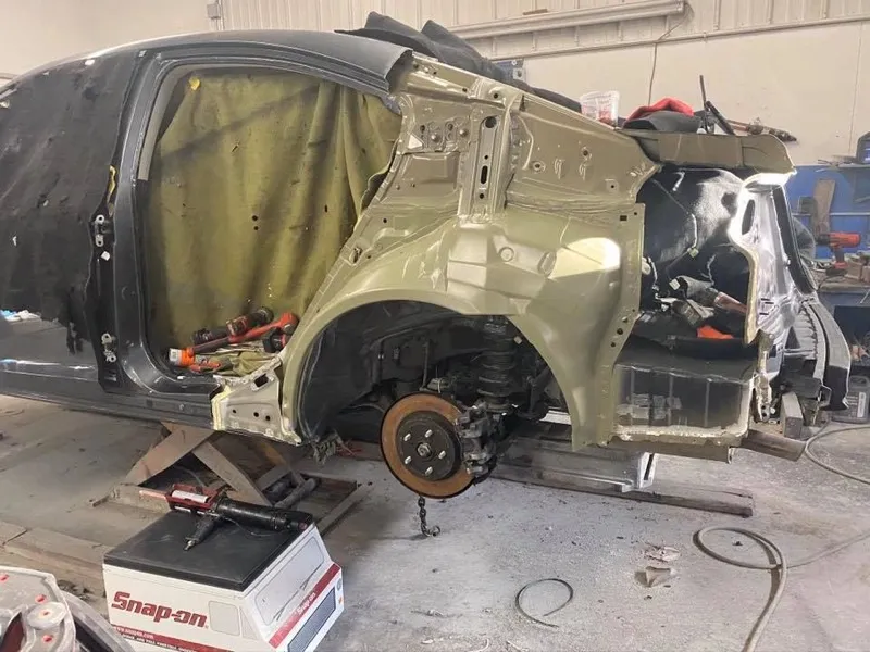 New wheelhouse installed on sedan during collision repair
