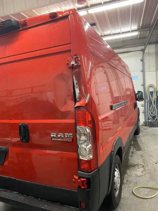 RAM ProMaster van with rear corner structure damage